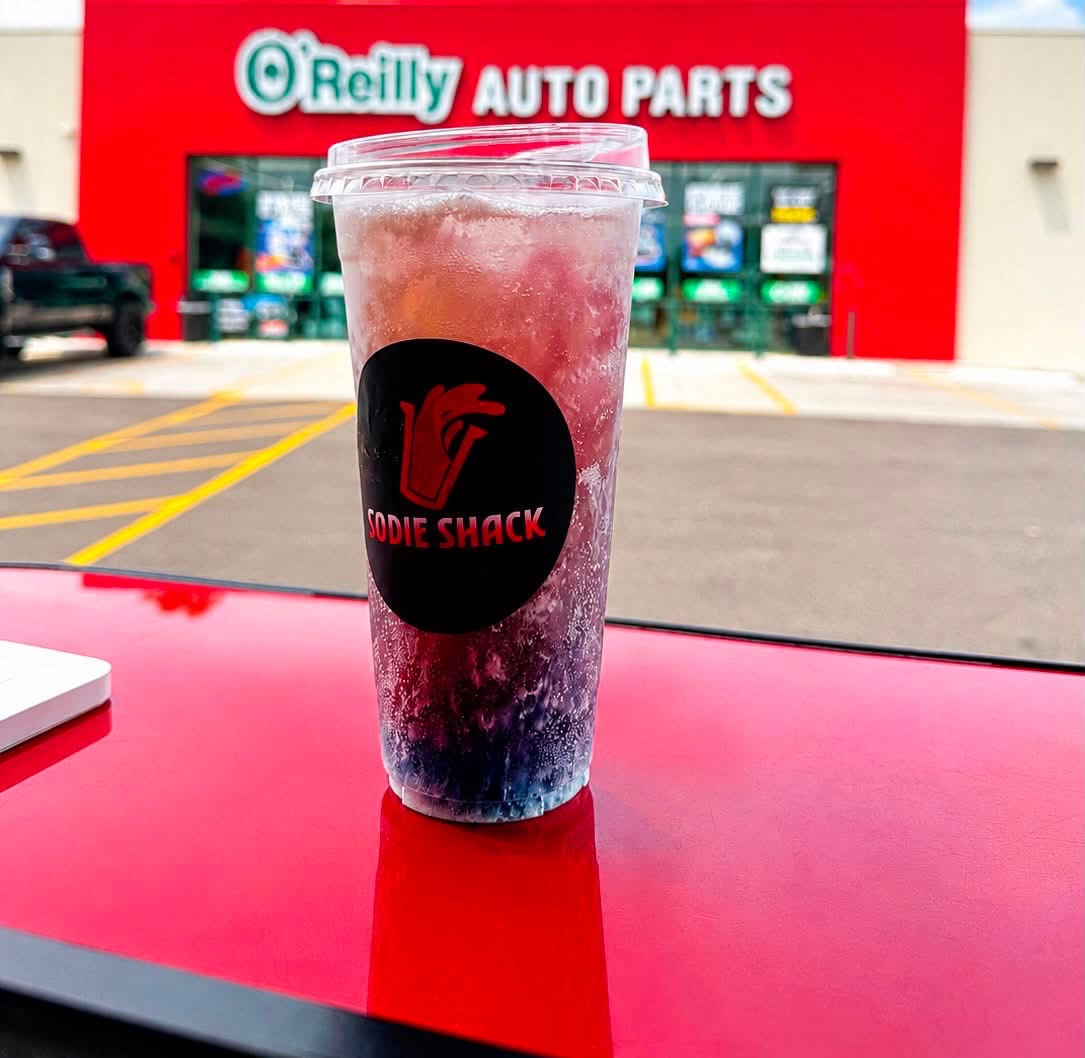 Layered blue and pink dirty soda in a Sodie Shack cup