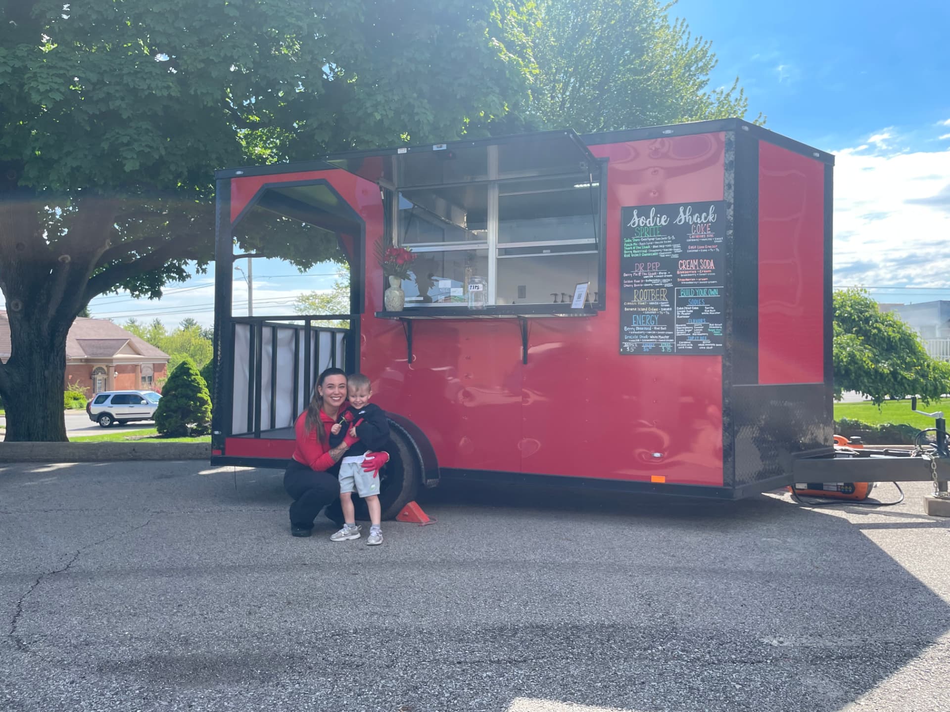 Calum and family in front of the red Sodie Shack trailer